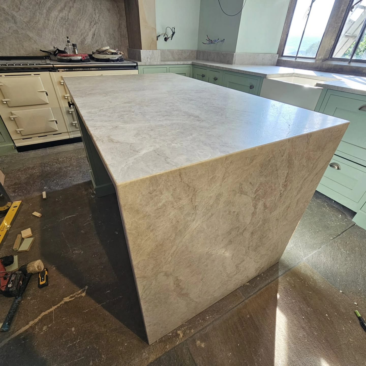 Taj Mahal Quartzite worktop run fitted in a countryside kitchen